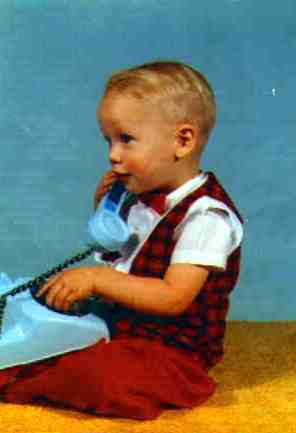 Jim at age 2 playing with a plastic blue phone. This is my mom's favorite picture of him